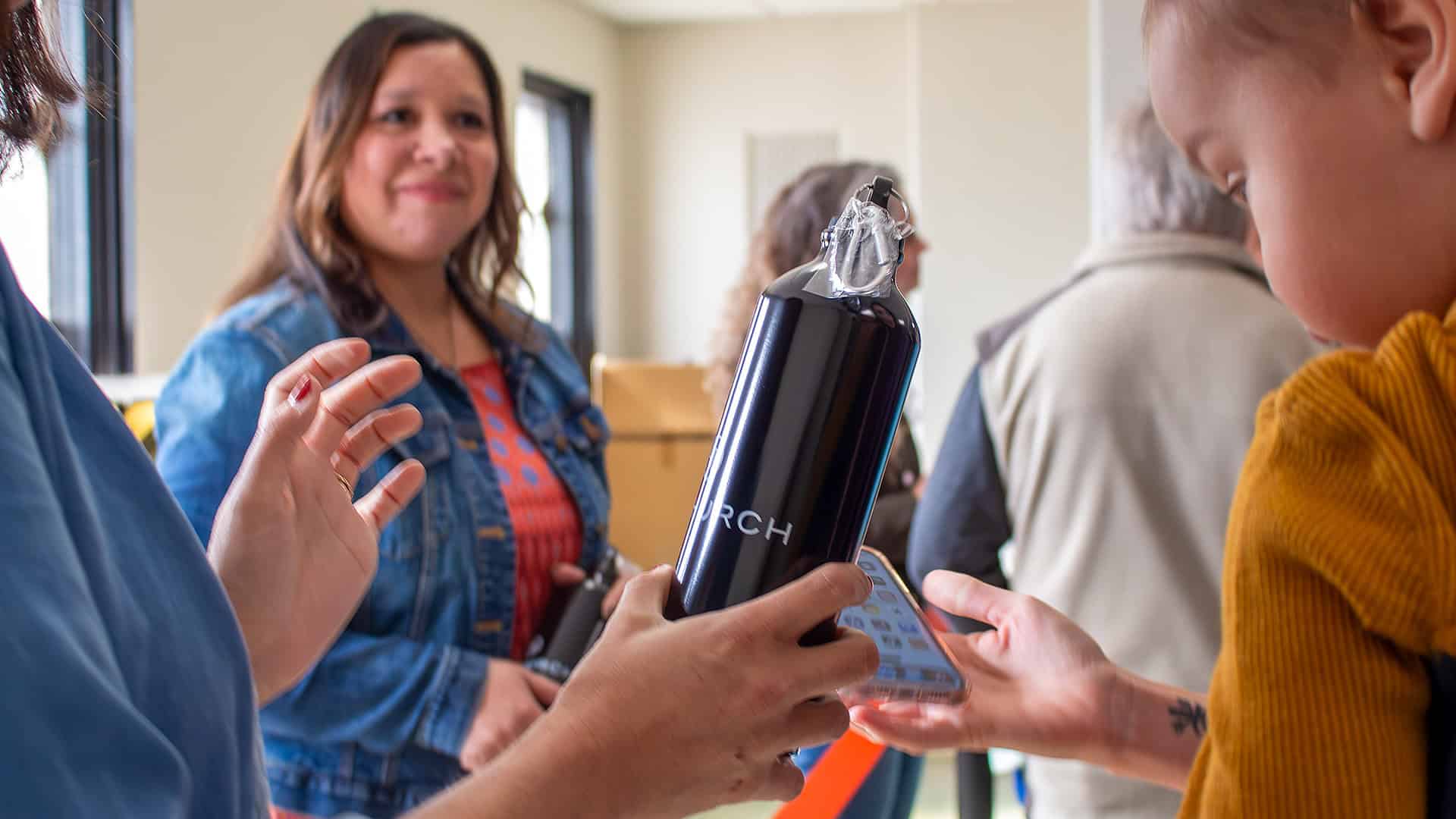 414 Church water tumbler giveaway table for the new app rollout
