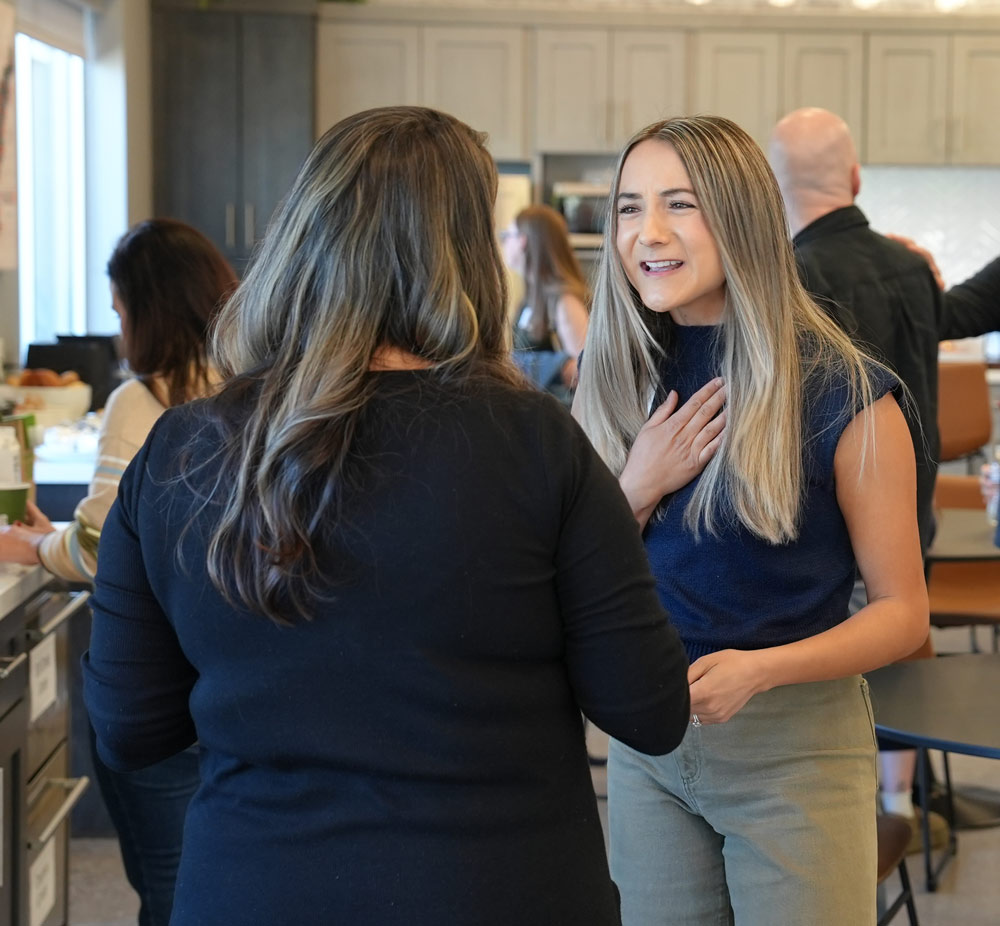 Two church staff members in conversation at a StudioC gathering
